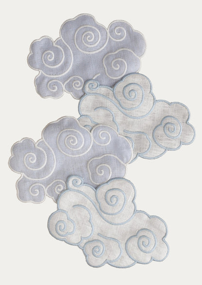 A set of four cloud-shaped linen cocktail napkins.