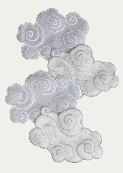 A set of four cloud-shaped linen cocktail napkins.