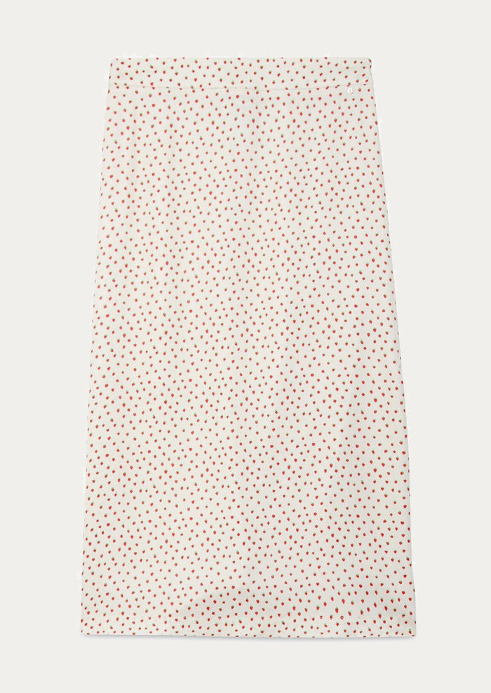 An ivory slip skirt with small red strawberry print.