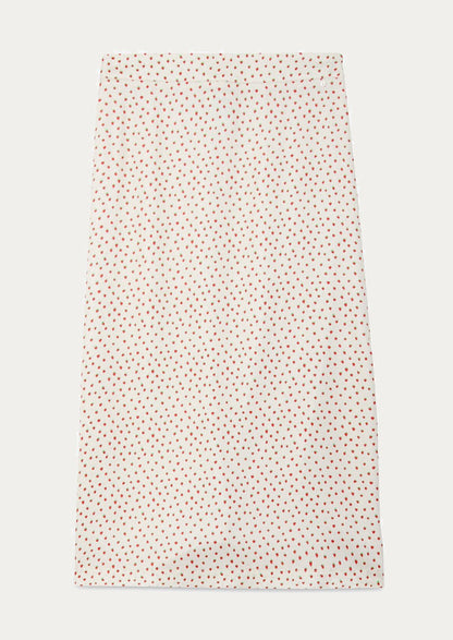 An ivory slip skirt with small red strawberry print.