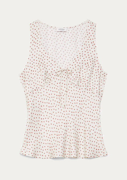 A v-neck blouse in cream with small strawberry print.