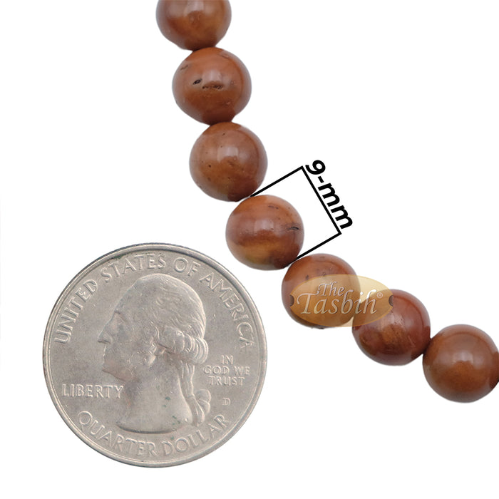 Brown wooden Islamic misbaha prayer beads with 99 beads and a black tassel cord.