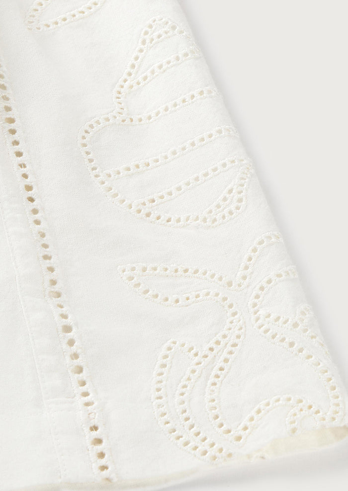 Close-up of a white fabric with decorative cut-out pattern